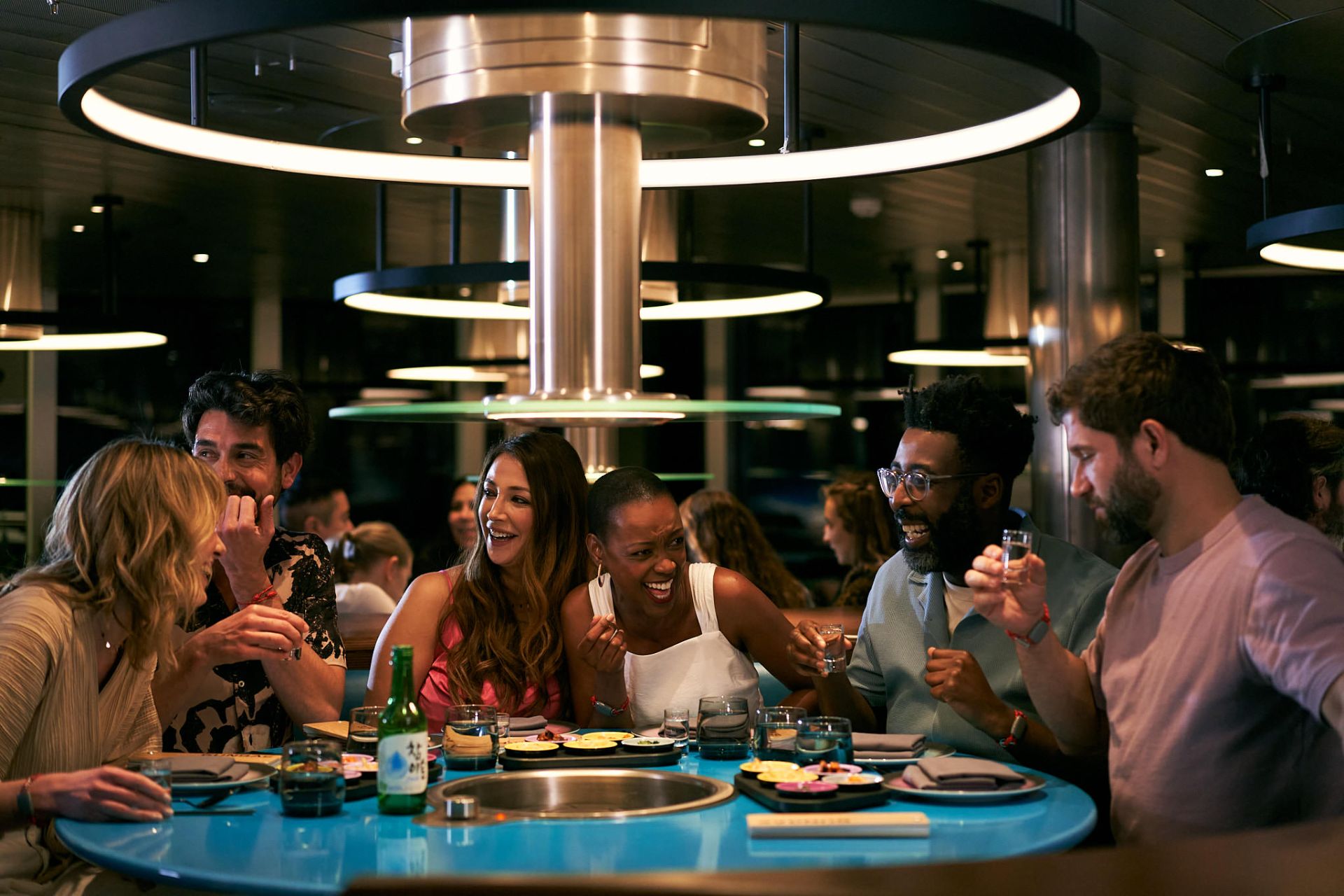 Friends sharing a meal at a ship restaurant